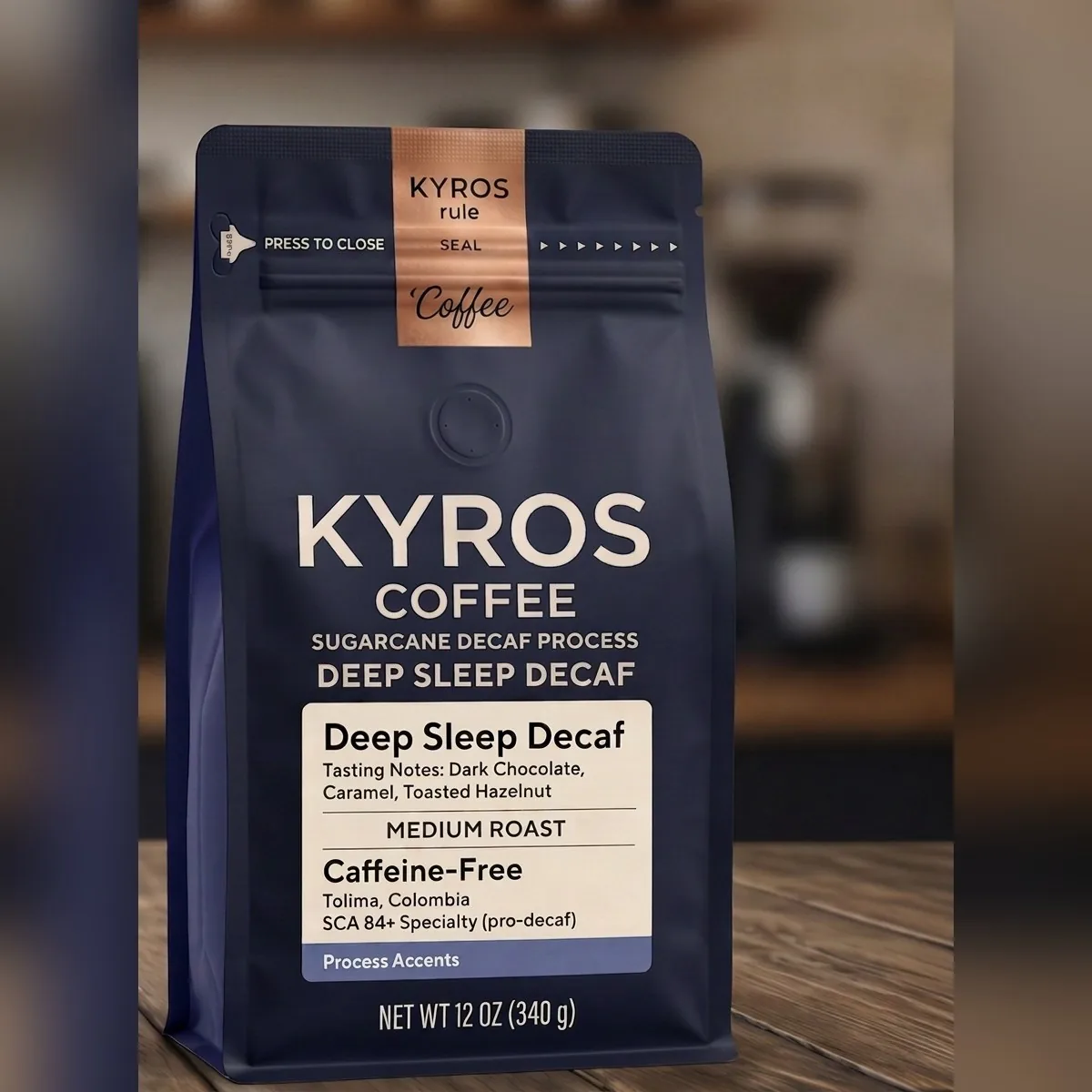 Kyros Deep Sleep Decaf bag, a navy matte pouch of sugarcane-process decaf coffee from Tolima, Colombia.